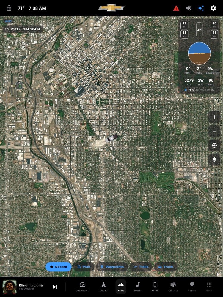 The XDirt off-road cockpit: satellite basemap, tire pressures, inclinometer, and the Record / Plan / Waypoints / Trails bar.